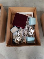 Box of flatware and serving utensils