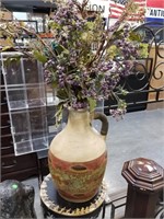 LARGE HANDLED FIGURAL JUG AND FAUX FLOWERS