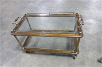 Glass top coffee table on castors