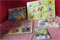 Child's wooden puzzles and books