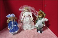 Three dolls on stands