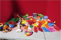 Box of small toys and cookie cutters