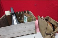 Old wooden box with old resusitator in bag