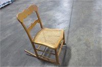 Small rocking chair with cane seat