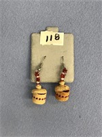 Pair of Aleut basket earrings 1 has discoloration