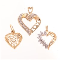 A Trio of Diamond Open Heart Pendants in Gold