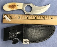 Knife has a bone handle, leather sheath, 6" long