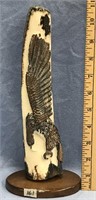 10" Relief carved eagle on black and brown fossili