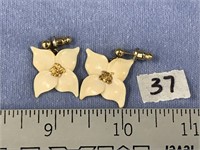 Pair of ivory flower earrings inset with gold nugg