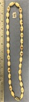 Fabulous 26" ivory bead necklace, all scrimshawed