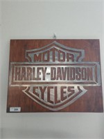 Harley-Davidson metal sign on wood measures 24 in
