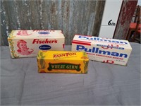 3 assorted advertising boxes