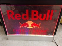 Small lighted Red Bull energy drink sign works