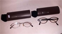 Two pairs of glasses in cases