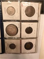 24 Foreign coins in Card Holders. SILVER?