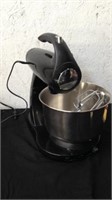 Sunbeam standing mixer with accessories powers on