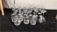 Group of wine glasses and etched drinking glasses