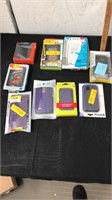 Group of phone cases and USB wall charger