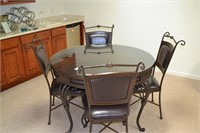 Round table w/glass top and 4 chairs