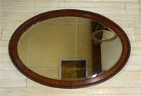 Mahogany Framed Oval Beveled Mirror.