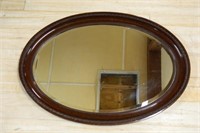 Mahogany Framed Oval Beveled Mirror.