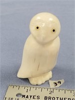 Large ivory snow owl, inset baleen and fossilized