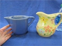 2 small pottery pitchers