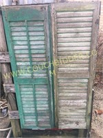 Pair of old green paint shutters