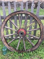 Antique wooden spoke iron wagon wheel