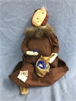 Antique hide and cloth doll with fur ruff and hid