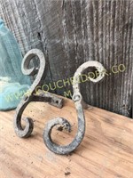 Pair of scrolled iron antique shutter tie backs