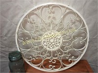Large scrolled iron wall medallion