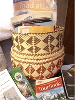 Basket with maps, tourbooks & atlas.
