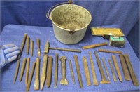 old pan with various iron chisels