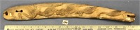 Fossilized walrus ivory tusk relief carved by Judy