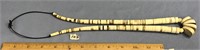 An impressive 28" fossilized ivory necklace, with