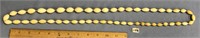 40" beaded graduated oval shaped ivory necklace