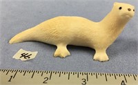 4 1/2" carved walrus ivory otter by Robert Aningay