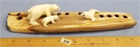 A highly pigmented fossilized ivory artifact, moun