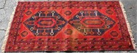 RED MEXICAN ZAPOTEC RUG WITH FEATHER MOTIF