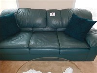 Green Leather Couch with 2 Accent Pillows