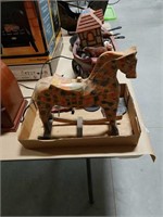 Flat with  large wooden rocking horse