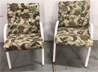Two patio chairs with cushions