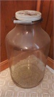 Large glass jar with wire handle
