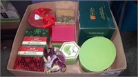 Box of Christmas gift boxes with ceramic teapot