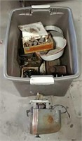 Large tote full of old cans, tools and parts