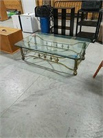 Glass top coffee table with metal frame
