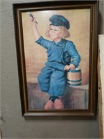 Little Dutch boy painter in frame