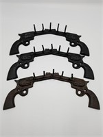 Three Cast Iron Pistol Wall Hangers