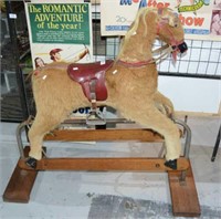 Vintage rocking horse on platform base